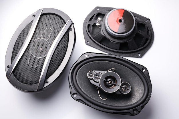 Black car sound speakers closeup on a white background audio system hard bass subwoofer