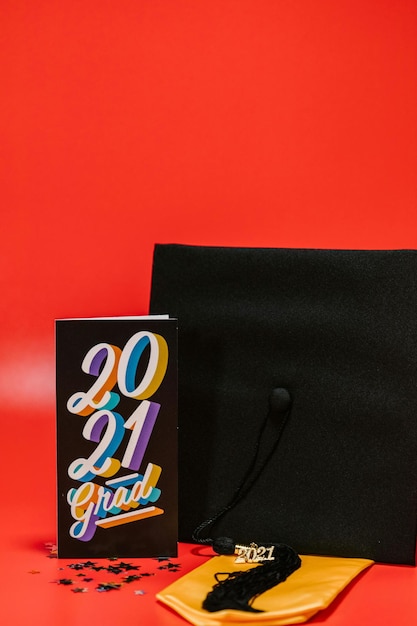 Photo black card beside graduation cap stock photo