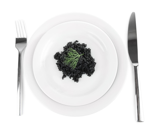 Black caviar on plate fork and knife isolated on white