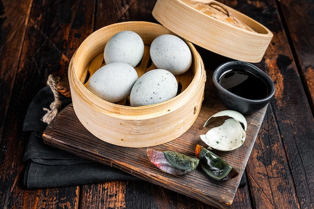 Black Century eggs preserved duck egg Chinese cuisine Wooden background Top view