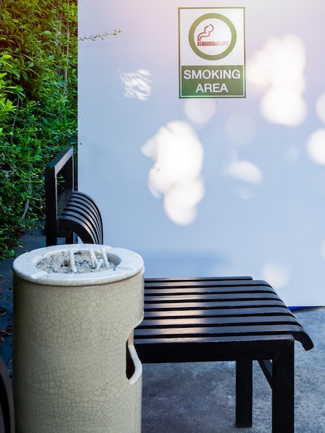 Black chairs with ashtray in smoking area