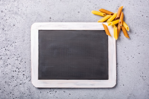 Black chalkboard with italian pasta