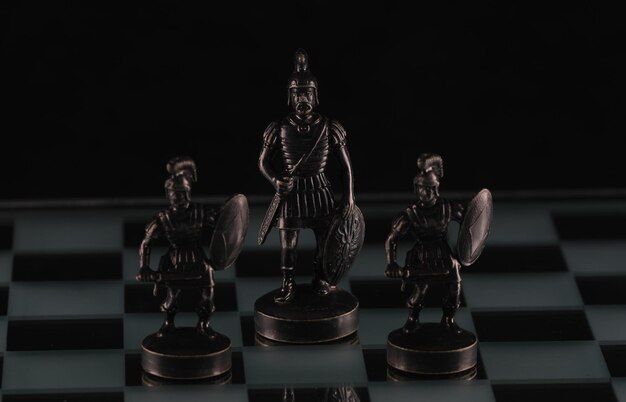 black chess pieces on a chessboard