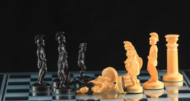 black chess pieces on a chessboard