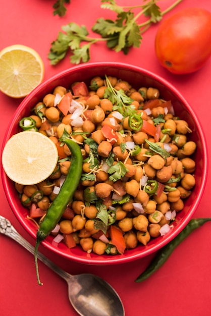 Black Chickpea Chaat or Kala Chana Chat recipe is a popular snack recipe from India, served in a bowl. selective focus