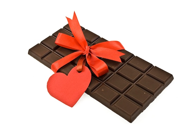 Black chocolate with red ribbon and tag heart