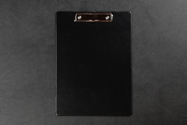Black clipboard on a table