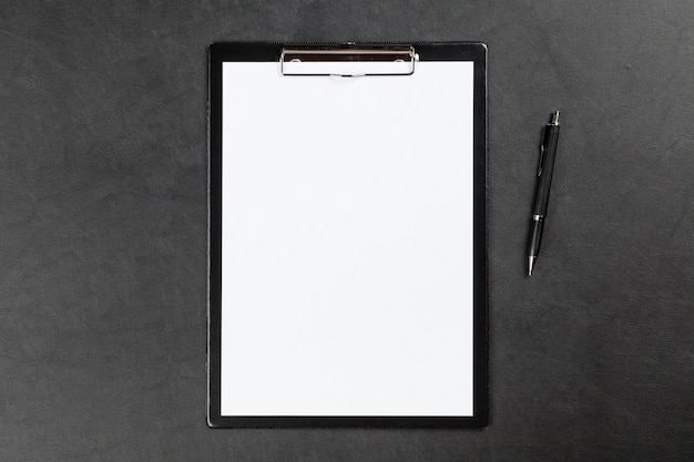 Black clipboard on a table