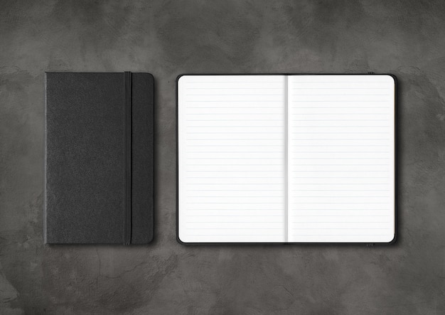 Photo black closed and open lined notebooks