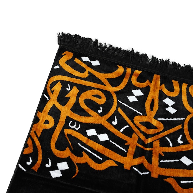 A black cloth with white and gold designs on it