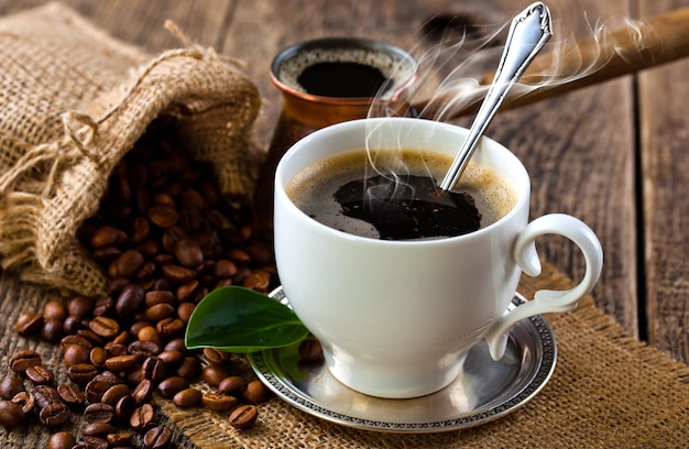 Black coffee beans on an old background