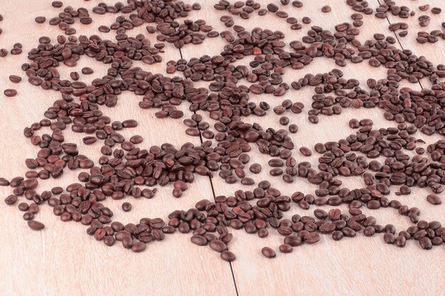 Black coffee beans on a wooden table.photo with copy space.