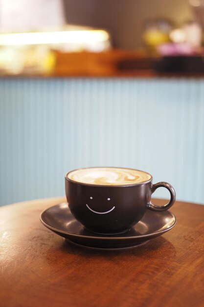 Black coffee cup with smile shape design on it