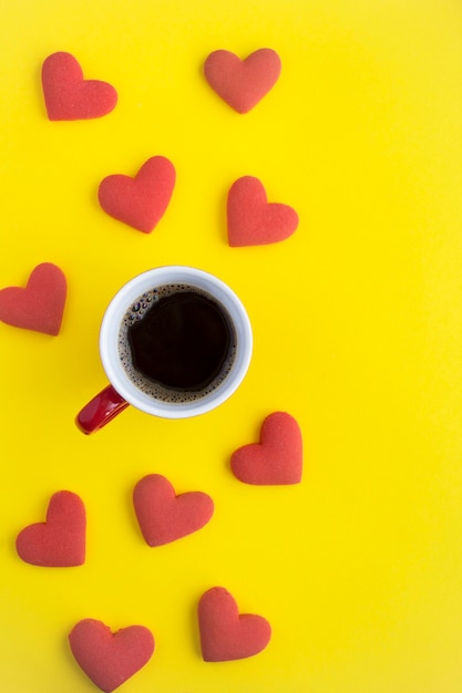 Black coffee and red heart shaped cookies