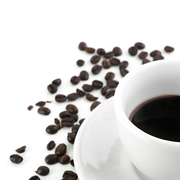 Black coffee with beans isolated on white