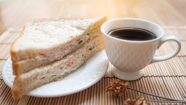 Black coffee with sandwiches