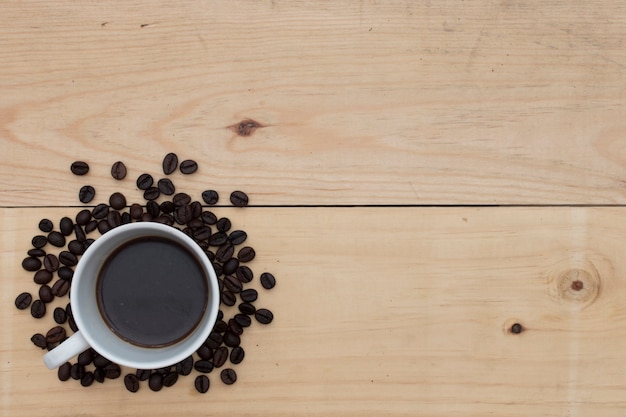 Black coffee on wood table.