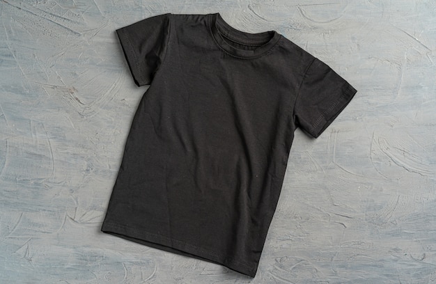 Photo black color plain t-shirt with copy space close up