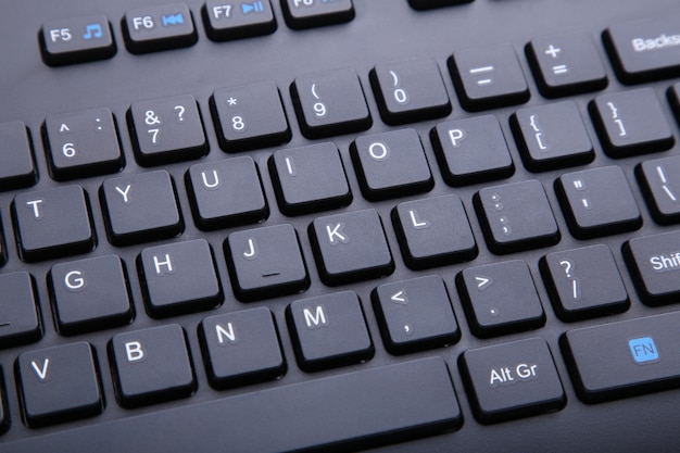 Black computer keyboard, english keyboard closeup, business or\
education concept