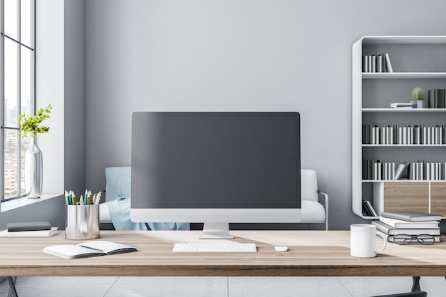 Black computer monitor with copyspace on wooden table in sunny\
room with big window and bookcase on background 3d rendering mock\
up