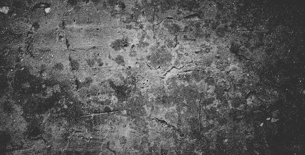 Black concrete wall or dark gray rough grainy stone texture background