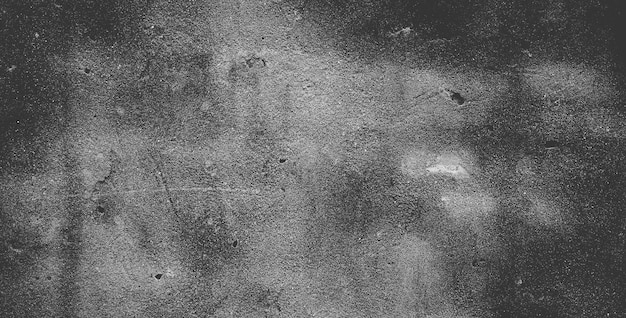 Black concrete wall or dark gray rough grainy stone texture background
