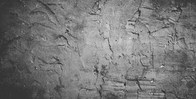 Черная бетонная стена или темно-серый грубый зернистый каменный фон текстуры