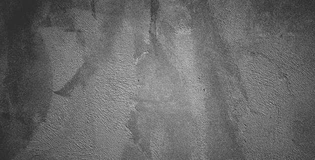 Black concrete wall or dark gray rough grainy stone texture background