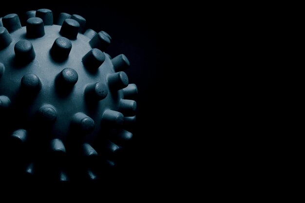 Black coronavirus model on a black background