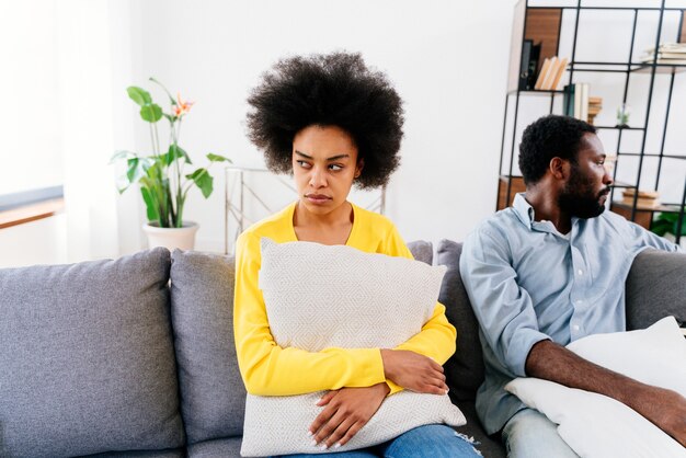 Black couple having a discussion at home, relationship\
crisis