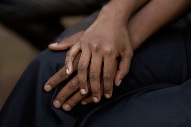 A black couple in love hold each other hand symbol of support trust and empathy