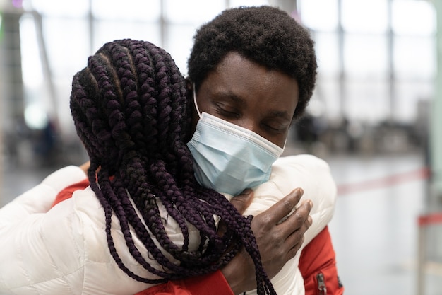 Photo black couple met in airport after separation due to covid