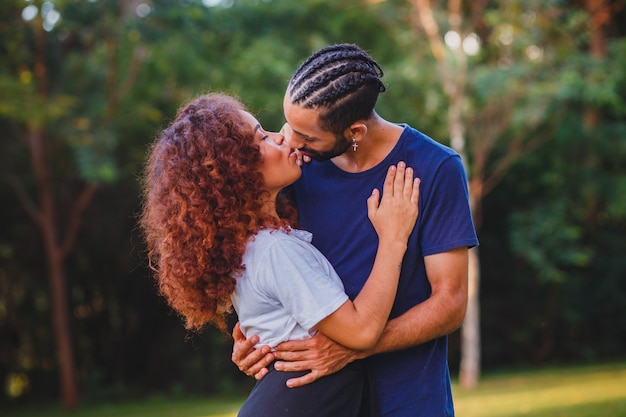 Black couple in the park in love. Passionate couple of lovers.