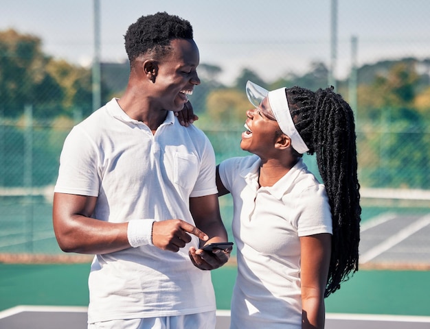 Premium Photo Black couple tennis and phone laughing or smile for online communication or social media fitness african man woman and happy tennis player streaming comic video or workout motivation on