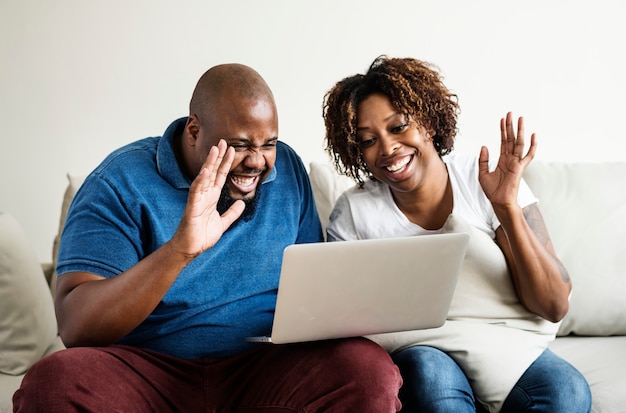 Black couple using digital device