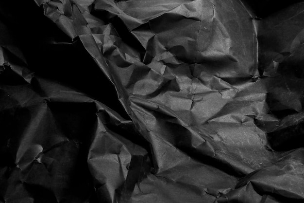 Foto sfondo di carta stropicciata stropicciata nera grunge texture di sfondo