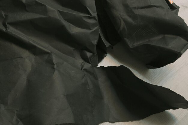 black creased crumpled paper background grunge texture backdrop