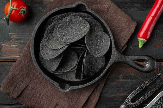 Black crispy potato chips set, top view flat lay