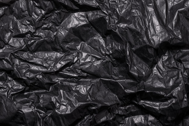 Текстурированный фон черный мятой бумаги