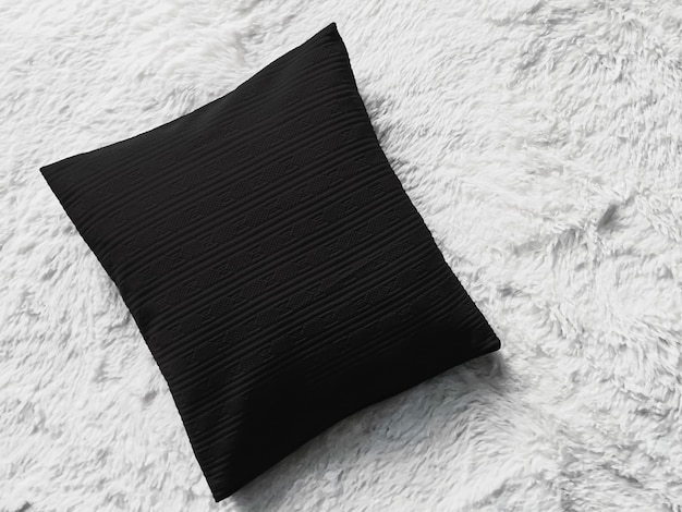 Black cushion throw pillow on white fluffy plaid blanket as flat lay background bedroom top view and...