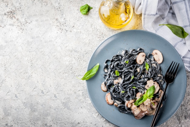 Black cuttlefish ink spaghetti pasta with mushrooms