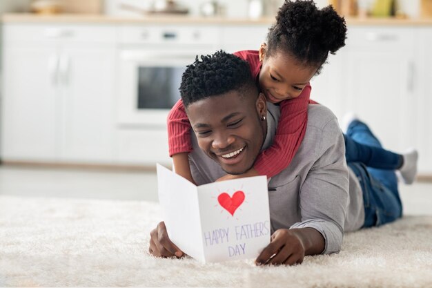 Black daddy and daughter celebrating fathers day