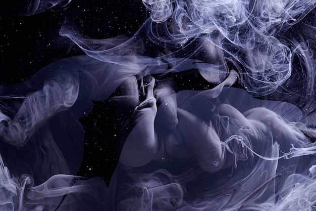 black dark abstract ocean background splashes and waves of paint under water clouds of interstellar smoke in motion
