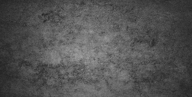 Black dark grunge background and texture of black concrete wall