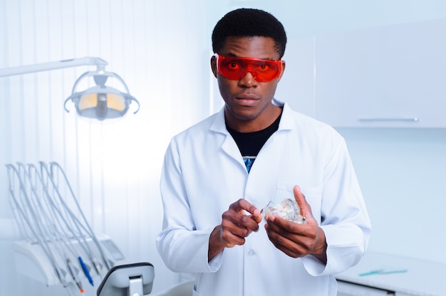 Black dentist in a dental clinic