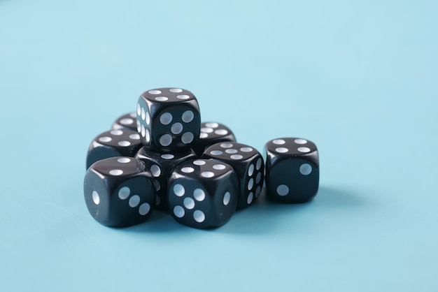 Photo black dice on a blue color background