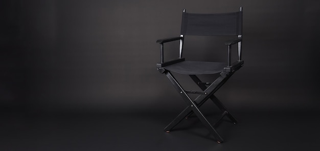 Black director chair isolated on black blackgroundx9