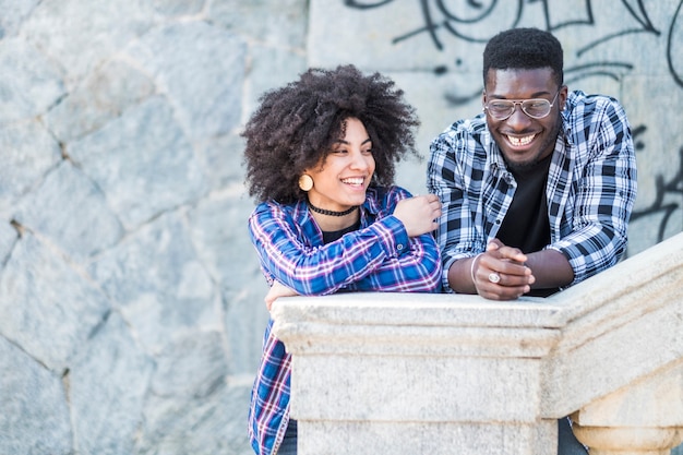 Black diversity african european couple enojy9ng and laughing together in the city in outdoor leisure activity 