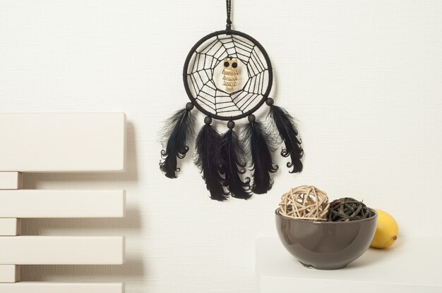 Photo black dream catcher in white interior