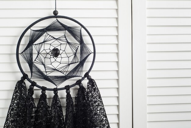 Photo black dream catcher with crocheted doilies